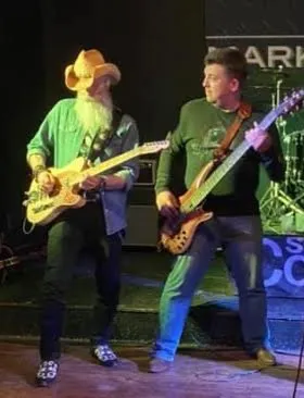 Dino and Tom performing together on stage