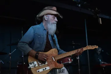 Dino playing telecaster on stage