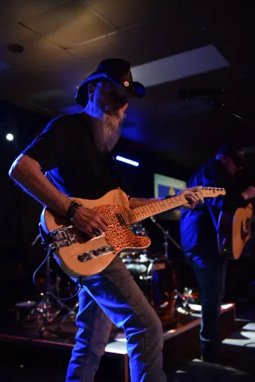 Dino on telecaster under blue lights