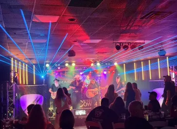 Band performing with laser light show