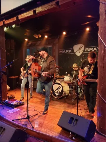 Full band on stage at Mark Bray venue