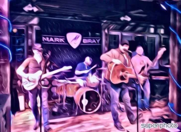 Band performing with neon pink and purple lighting