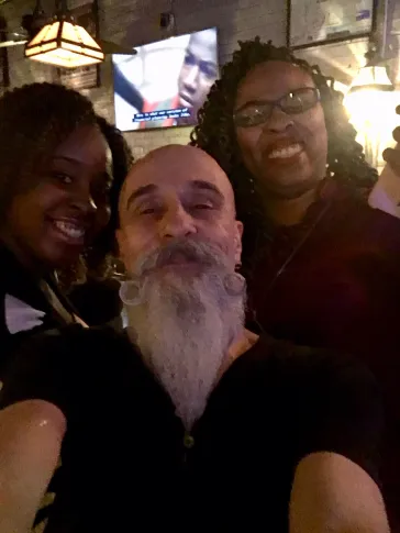 Mark with fans at a bar show