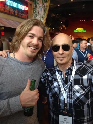 Dino with a fan at a music conference