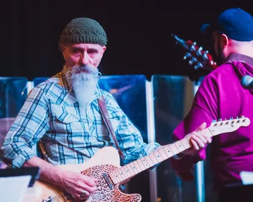 Mark and another guitarist performing on stage