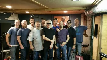 Large group photo at a rehearsal or jam session
