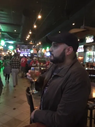 Band member relaxing at a bar